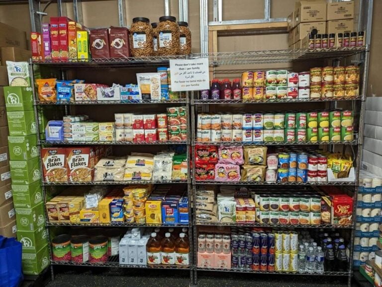 Stocked food pantry shelves at Ummah's Kitchen at AUCC