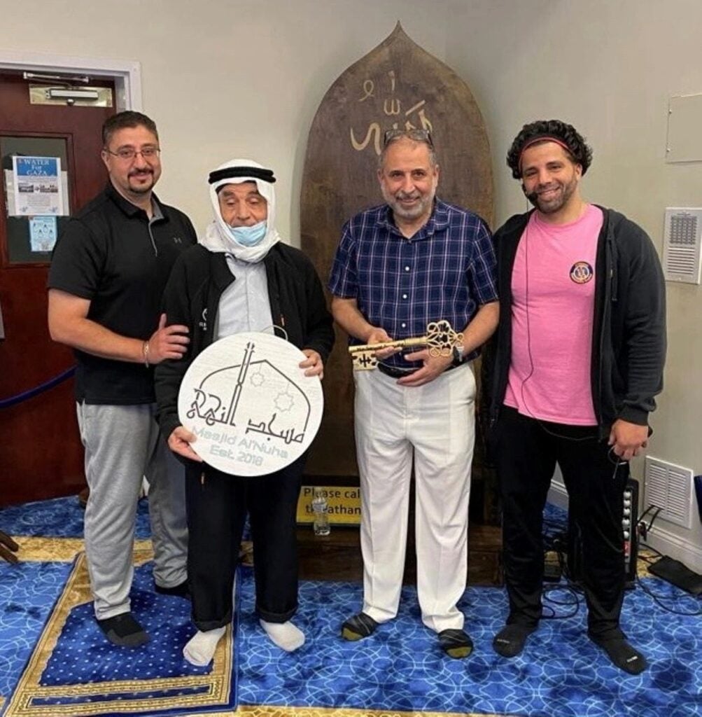 Dr. Amer and Al-Hajji Abu Rayed receiving an honorary key to Masjid Al'Nuha