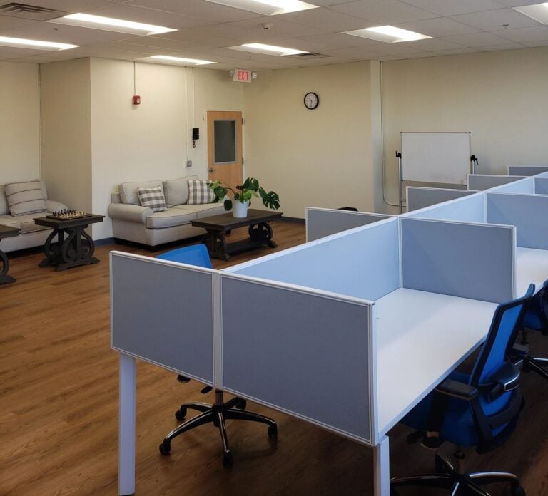 AUCC hybrid rooms: lounge seating, whiteboard and flexible desk space